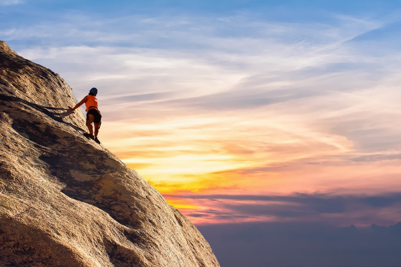 person climbing rocks