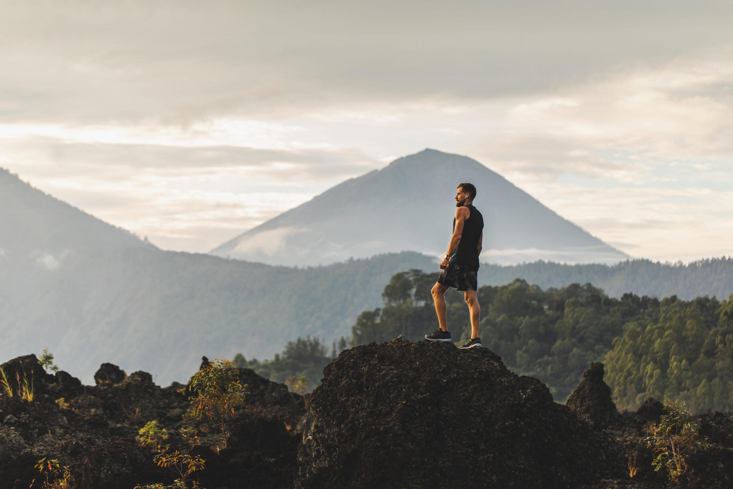Fit man standing on top of a stone