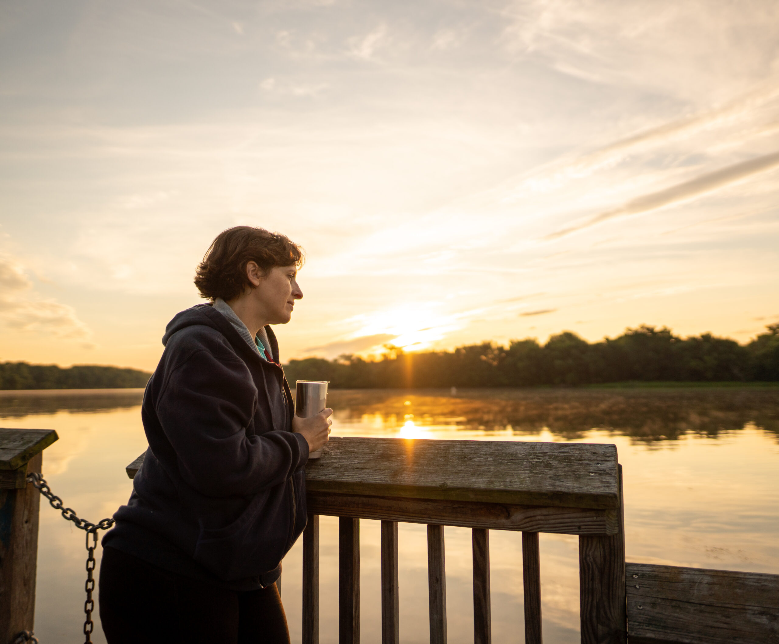 woman looking over a lake