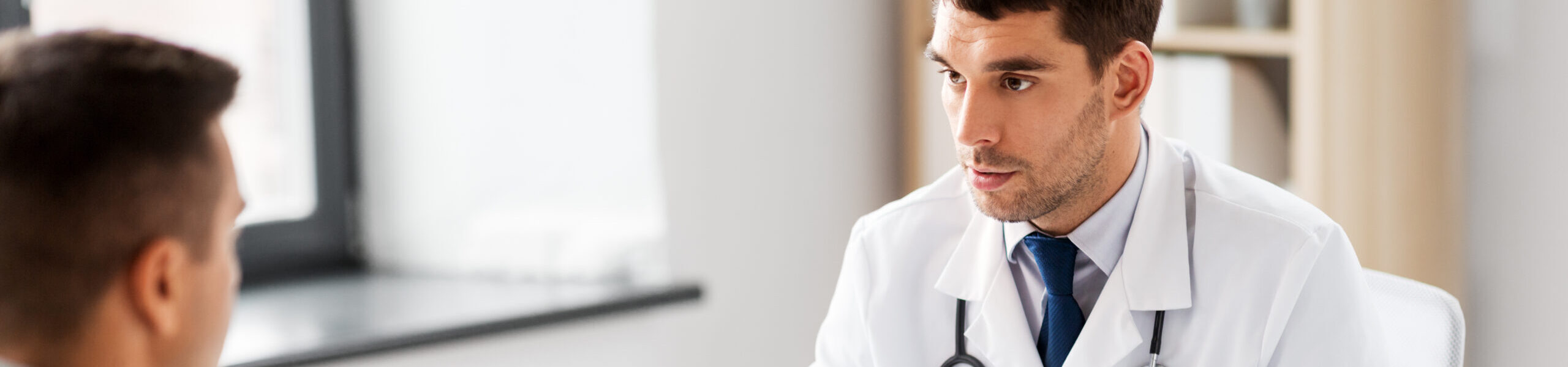 Doctor discussing medications with a patient