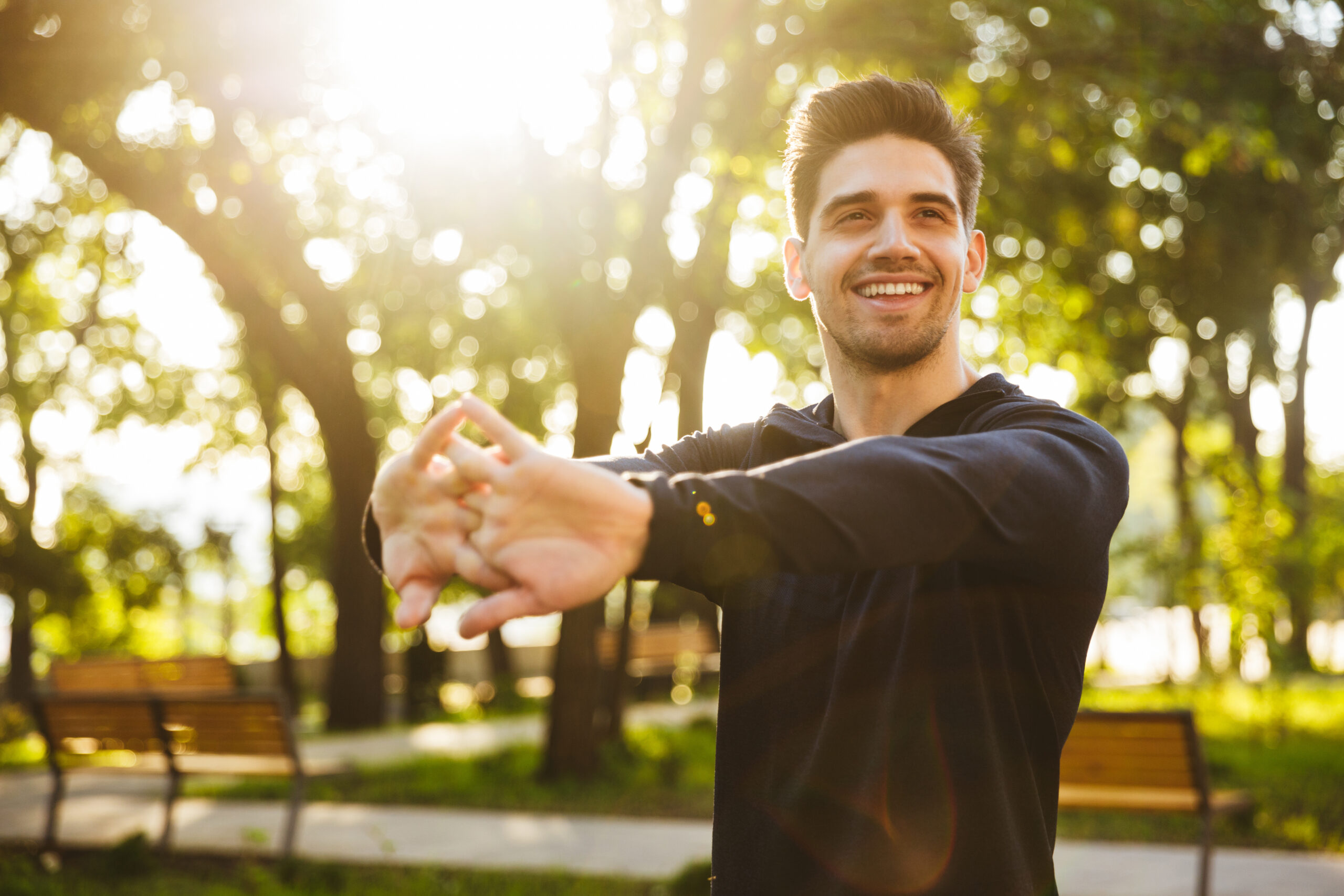 man streching in park wondering the Enclomiphene Side Effects